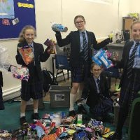 students with their collected waste