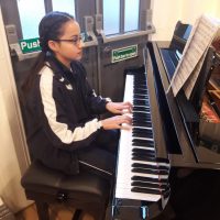 child playing the piano