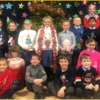 Children smiling at the Christmas celebration