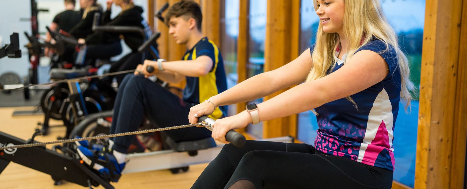 Students using the rowing machine