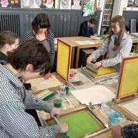 Students practicing screen printing