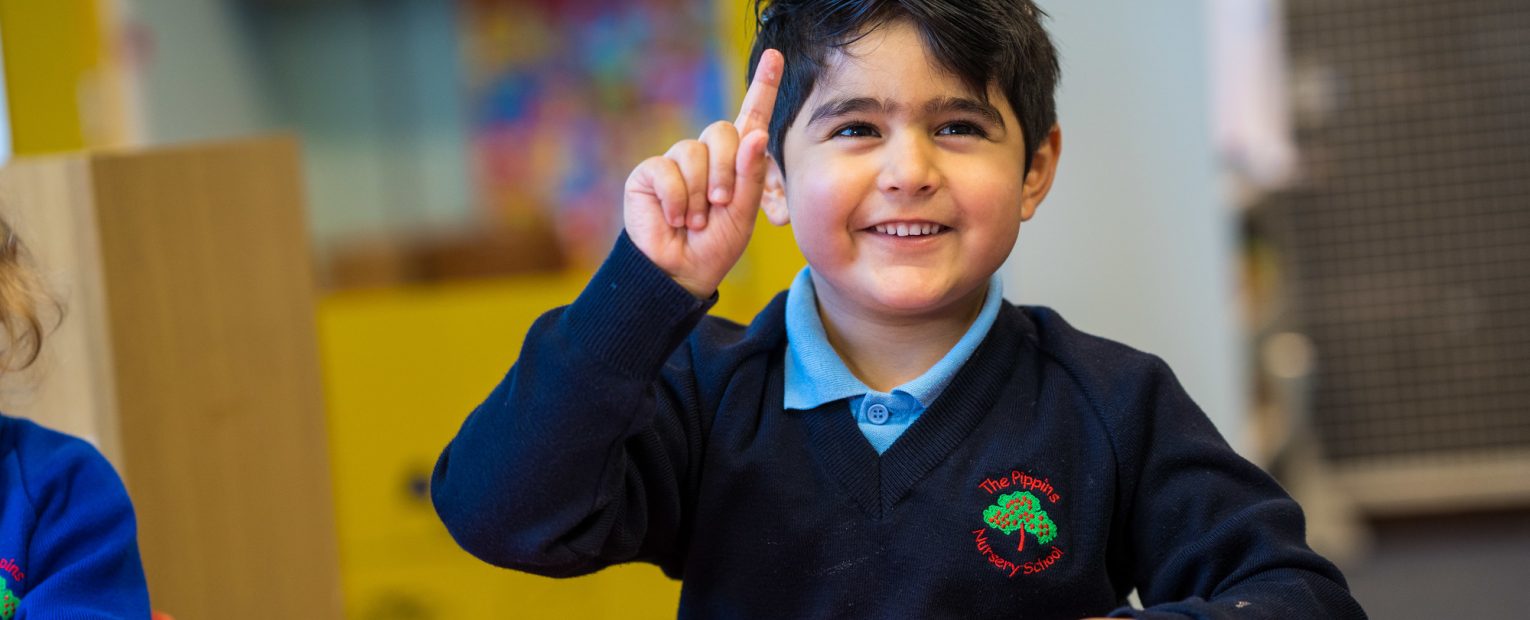 child putting a hand up